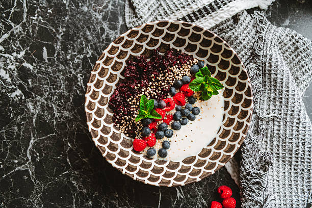 Delicious fruit bowl with black rice and yoghurt