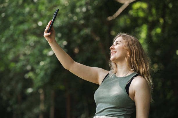 istock A young woman using an application on her smartphone to check the air quality in the forest 2200220914