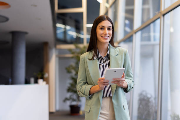 istock Ambitious Latina entrepreneur making business decisions using a tablet 2200221036