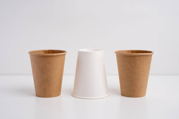 istock Eco-friendly disposable paper tableware. Paper cup, wooden forks, recycling. Copy space 2200221681