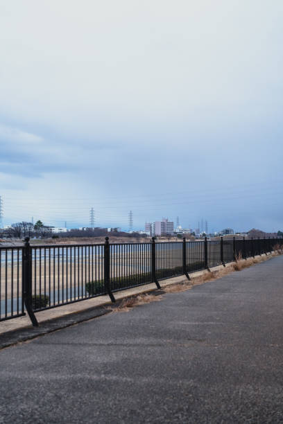 istock Road along the river at dusk 2200223851