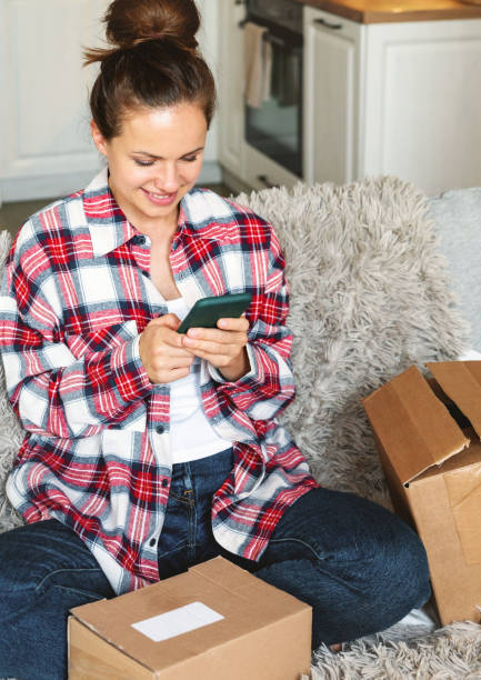 istock One-click ordering and same-day delivery concept. Woman sharing her online shopping experience. 2200224435