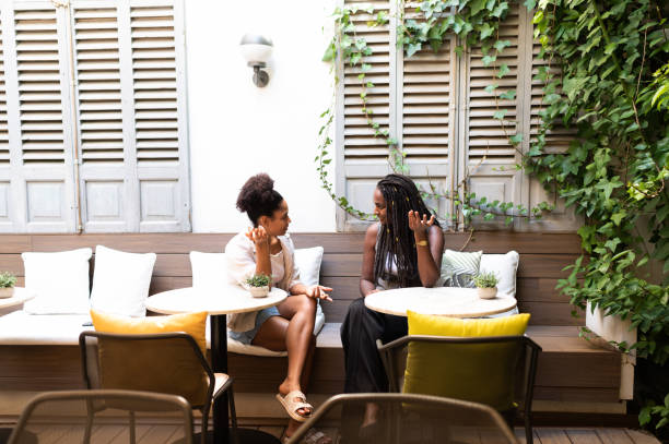 istock Two women talking in cafe 2200226170