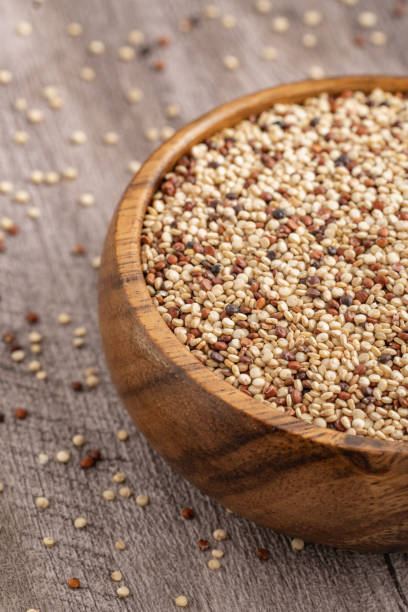 istock Rustic wooden bowl filled with mixed quinoa grains 2200229540