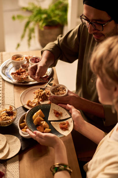 istock Enjoying Traditional Mexican Cuisine Together at Table 2200230034