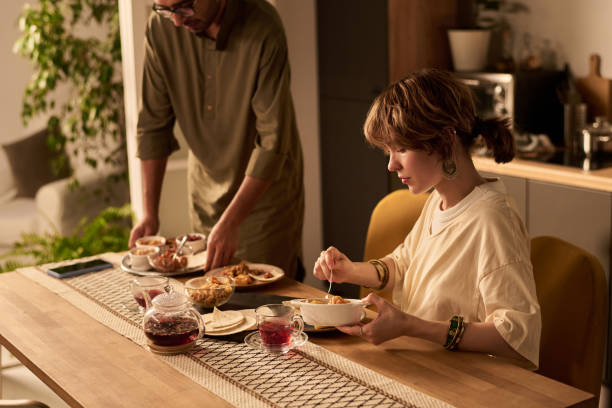 istock Sharing a Meal Together at Home in Relaxed Atmosphere 2200230035