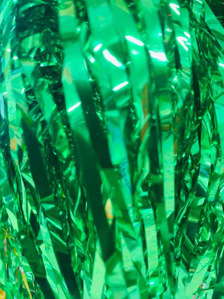 istock Colorful Carnival Background: A vibrant scene with scattered confetti and streamers creating a festive atmosphere. Festive Party Background: Bright confetti and streamers in vivid hues, perfect for celebrating carnival.Confetti & Streamers Texture 2200230224