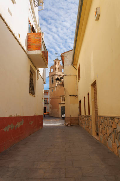 istock Access road to the church square in Benimassot 2200230371