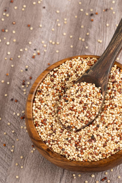 istock Mixed Quinoa Seeds in Wooden Bowl with Rustic Spoon 2200231417