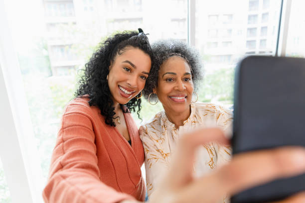 istock Multiracial mother and daughter taking a selfie together 2200232520
