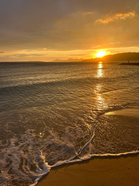 istock A stunning sunset over a peaceful shoreline 2200233795