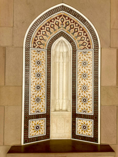 istock Intricate Islamic Geometric Patterns and Arched Window in Traditional Omani Architecture, Beautiful Mosque Interior Design, Muscat, Oman (191 characters) 2200234108