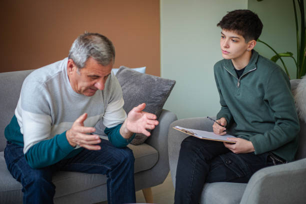istock Psychotherapy, an elderly man in a psychotherapy session 2200235111