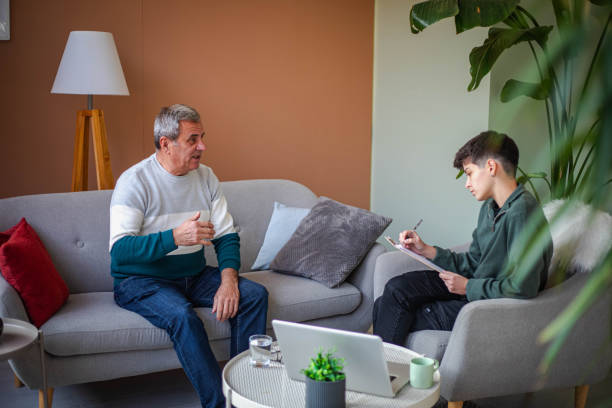 istock Psychotherapy, an elderly man in a psychotherapy session 2200235121