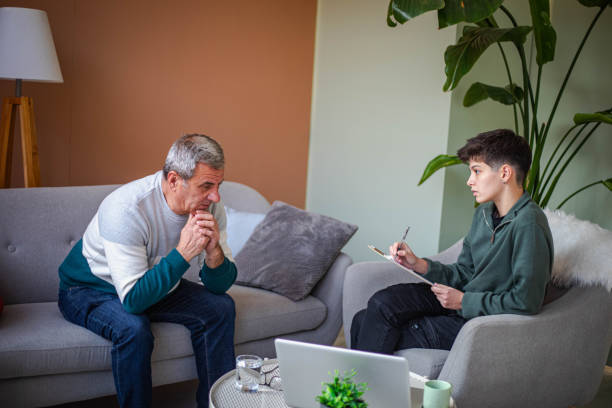 istock Psychotherapy, an elderly man in a psychotherapy session 2200235130