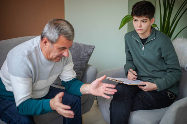 istock Psychotherapy, an elderly man in a psychotherapy session 2200235199