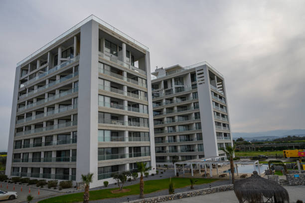 istock Modern architectural marvels rise against a cloudy sky near a serene outdoor space in a tranquil setting 2200236636
