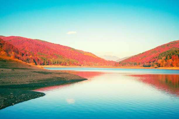 istock Beautiful mountain lake with reflection in autumn 2200239791