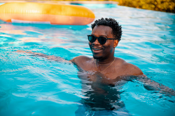 istock Summer sunbathing and enjoying in the pool 2200241172