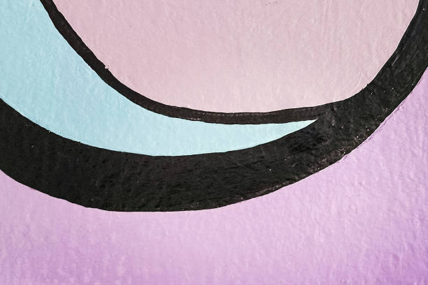 A background of colorful handprints in spray paint