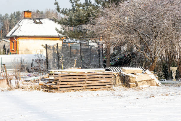Backyard of fishing house in winter forest