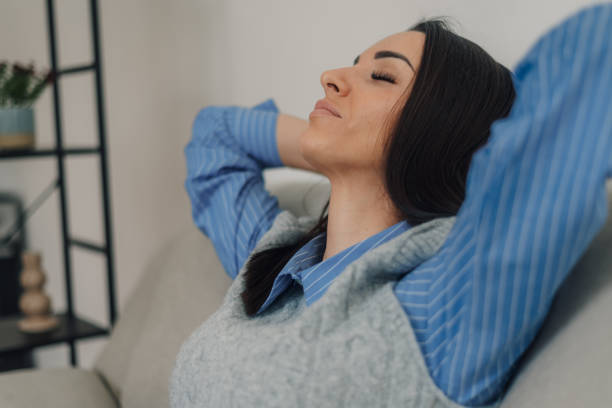 istock Businesswoman relaxing on sofa after work: enjoying peace and quiet 2200251757