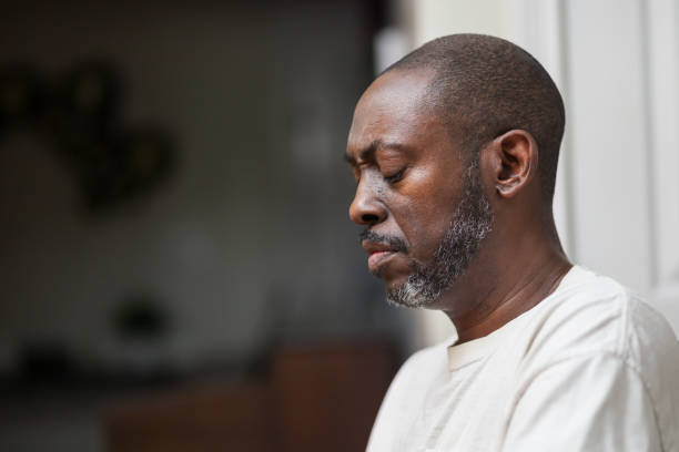 istock Portrait of a black man praying 2200253276