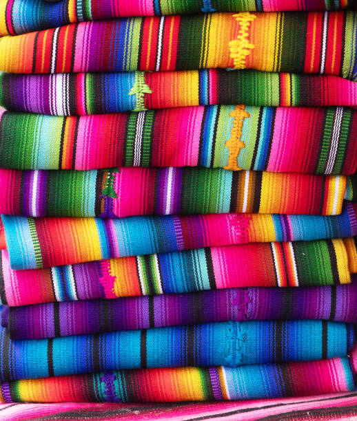 Full frame , colourful abstract of hand woven Mayan fabrics stacked on display. Panajachel, Lake Atitlan, Guatemala.