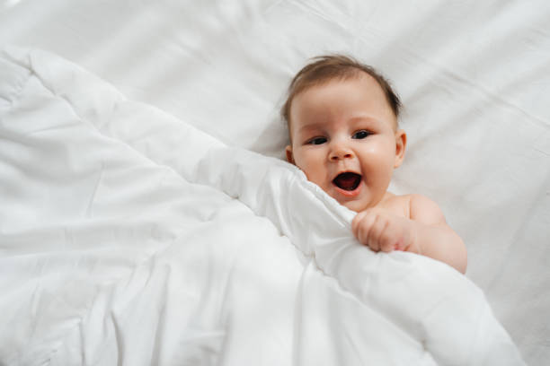 istock Cheerful Baby Enjoying the Sunny Room 2200255721