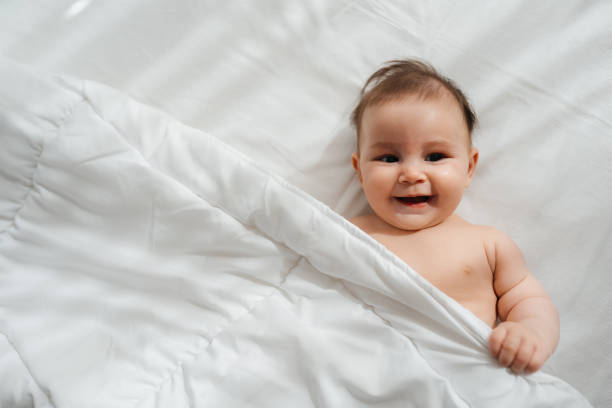 istock Cheerful Baby Enjoying the Sunny Room 2200255728