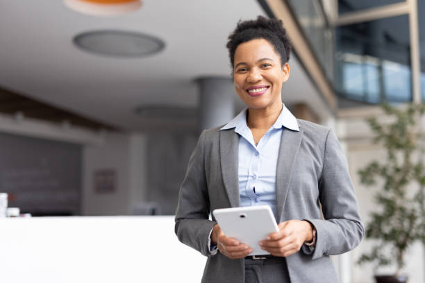 istock Mature African American entrepreneur checking emails on her tablet 2200260599