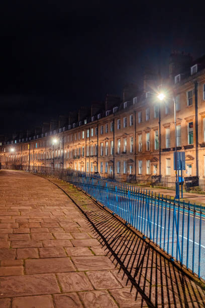 istock Empty street in bath at night illuminating historic buildings 2200261682