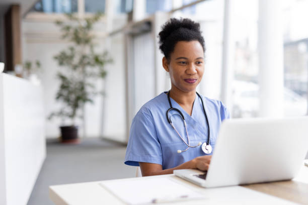 istock Mature African American nurse using a laptop for hospital administration 2200261801