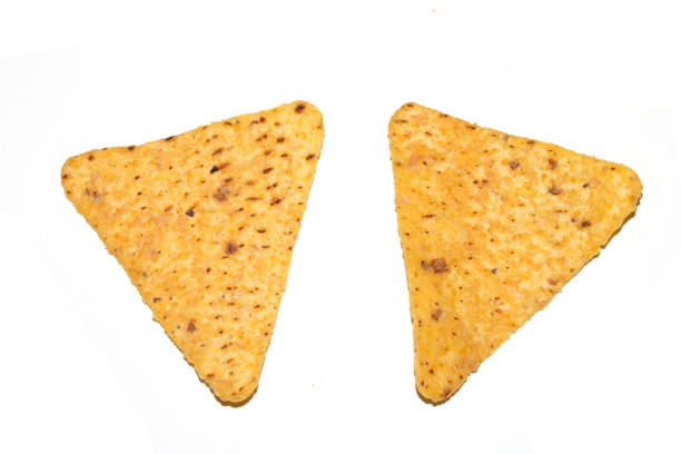 Pile of mexican nachos or tortilla chips, isolated on a white background