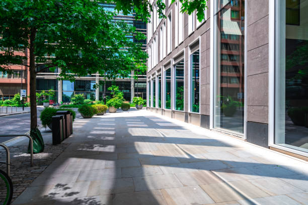 istock Empty street with modern buildings and greenery in london, uk 2200266030