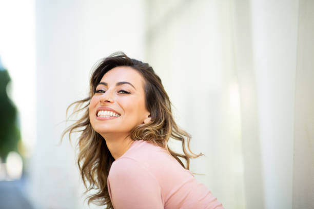 istock Close up happy young woman smiling 2200268840
