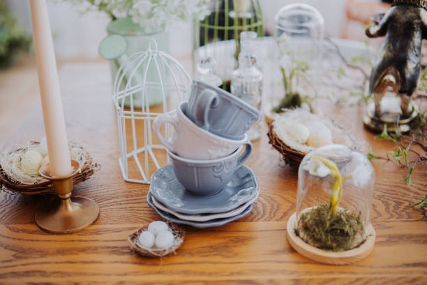 istock Stacked cups and nature-inspired decor on a wooden table for spring gathering 2200270118