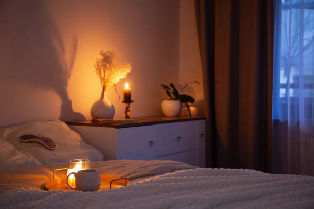istock cup of tea in bedroom at night 2200270246