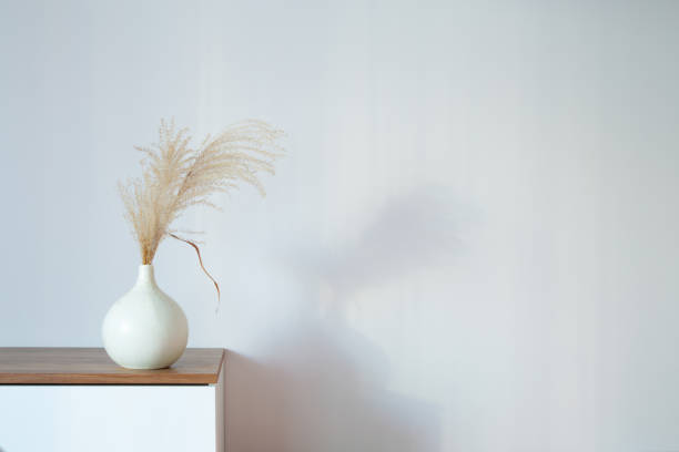 istock dry cereal ornamental plants in vase on background white wall 2200270256