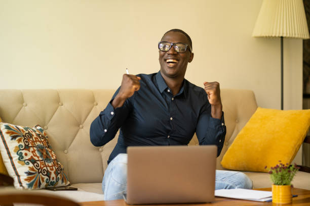 istock An Afro-American man is celebrating his success 2200271553