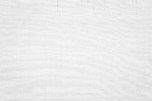 istock White color fabric canvas woven texture background in pattern light blank. Natural gauze linen, carpet wool and cotton cloth textile textured as clean empty for decoration text. Grey sack material. 2200271585