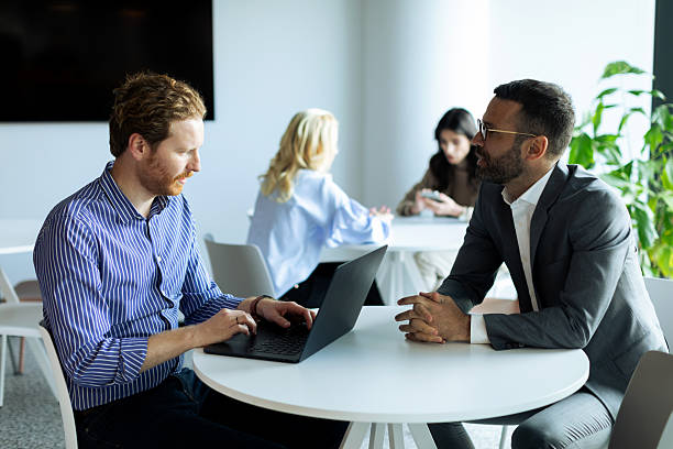istock Business team in the office having meeting 2200271772
