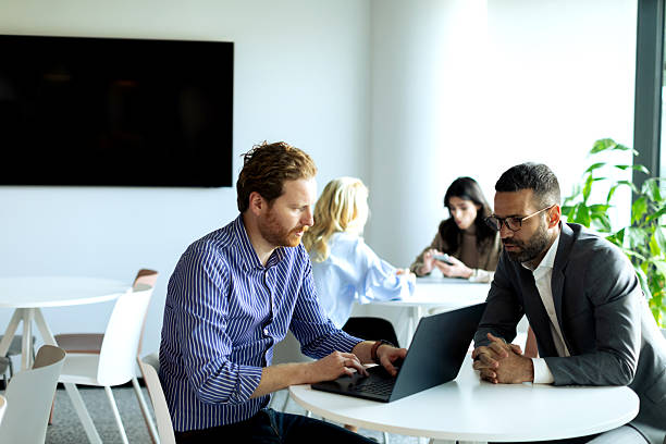 istock Business team in the office having meeting 2200271850