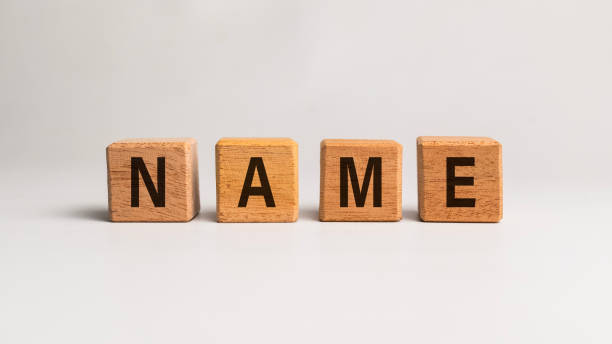 istock name word text on wooden block on white background 2200278414