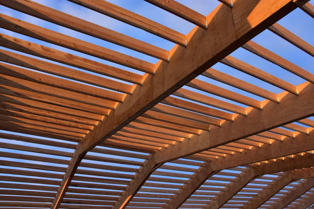 istock Large wood rafters installed for new building. 2200279601