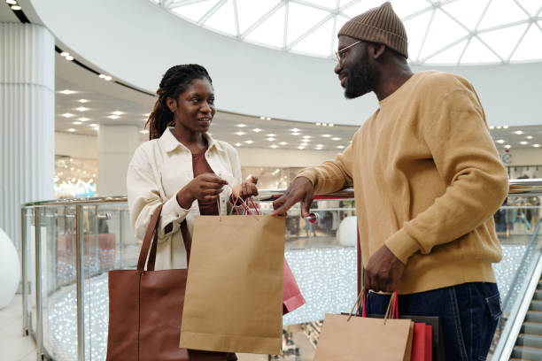 istock Woman opening paperbag with purchase 2200284639