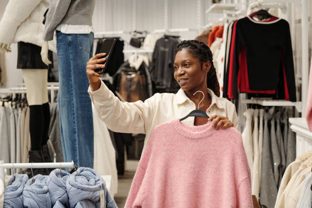 istock Shopper taking selfie in boutique 2200284657