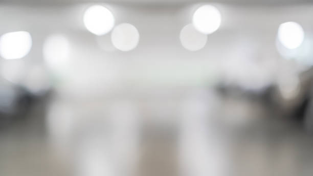 istock Parking garage blur background with blurry building interior lot space and bright illumination light bokeh for automotive vehicle and car insurance safety concept 2200284962