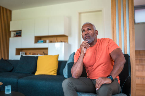 istock Stressed Hispanic Man in Living Room 2200287145
