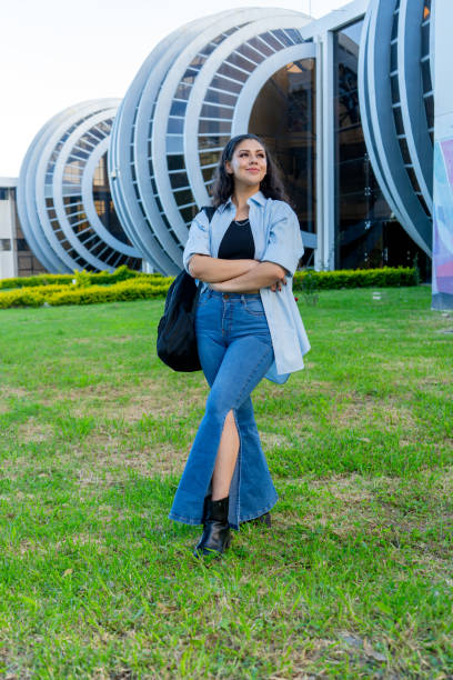 istock Hispanic student woman standing with arms crossed. 2200288526
